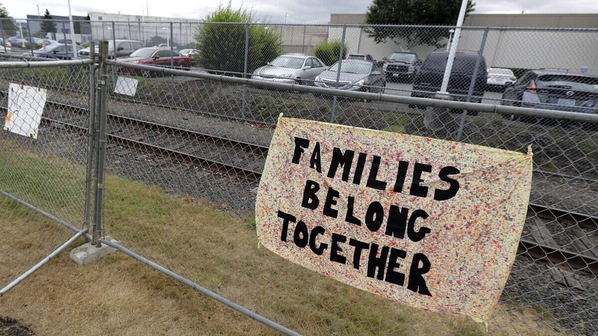 This sign was on a fence outside the Northwest Detention Center in Tacoma a year ago. The same sentiment runs deep among immigrants detained while crossing the border in South Texas. A U.S. District Court ruling in Seattle Tuesday preserves the right to bond hearings for asylum seekers.