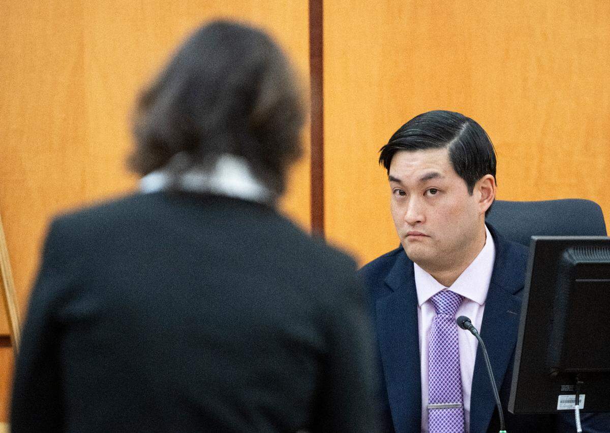Defendant Timothy Rankine testifies under cross examination from Special Assistant Attorney General Patty Eakes during the trial of three Tacoma Police officers in the killing of Manny Ellis at Pierce County Superior Court, Tuesday, Dec. 5, 2023, in Tacoma, Wash. Tacoma Police Officers Christopher Burbank, Matthew Collins and Timothy Rankine stand trial for charges related to the March 2020 killing of Manny Ellis. (Brian Hayes / Pool Photo – The News Tribune)