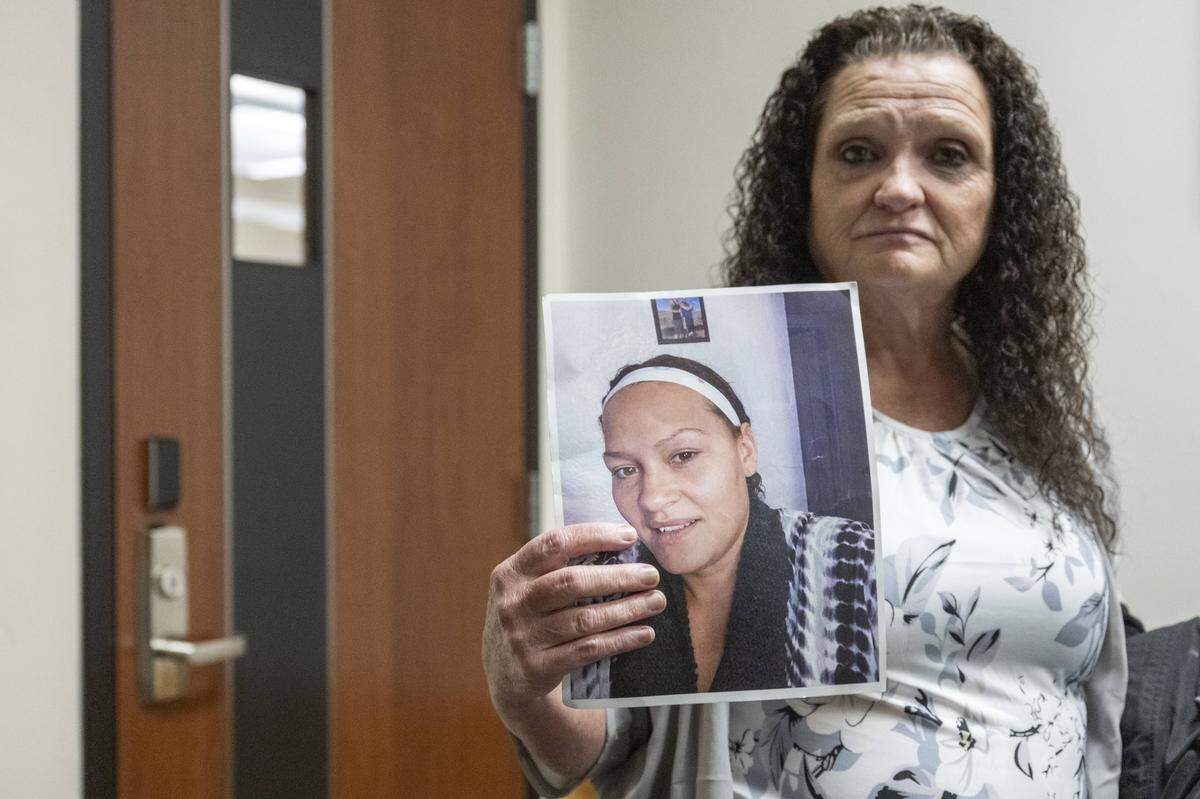 A photo of Angelina Palmer is held by her mother, Joanie Palmer, after the sentencing of Jerrmell Warren on Friday, Oct. 17, 2025, at Pierce County Superior Court in Tacoma, Wash. Warren was convicted by a jury in August of felony murder for killing 39-year-old Angelina Palmer outside a Spanaway gas station in May 2022.