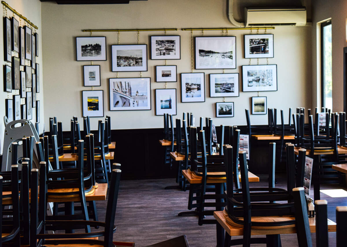 The owners worked with local fishermen and the history museum to collect photographs honoring the city’s maritime past and the building’s former life as a TideRunner boat facility.