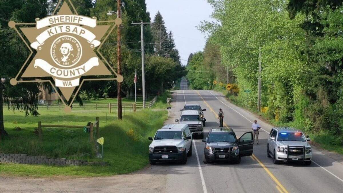 Kitsap County Sheriff’s investigators surround a car after a hit-and-run collision north of Burley on Saturday.