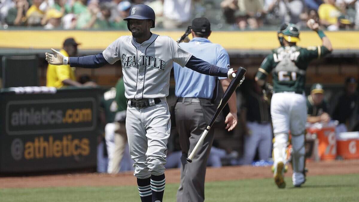 Seattle Mariners’ Dee Gordon reacts after striking out against the Oakland Athletics during the fifth inning of a baseball game in Oakland, Calif., Wednesday, Aug. 15, 2018. (AP Photo/Jeff Chiu)