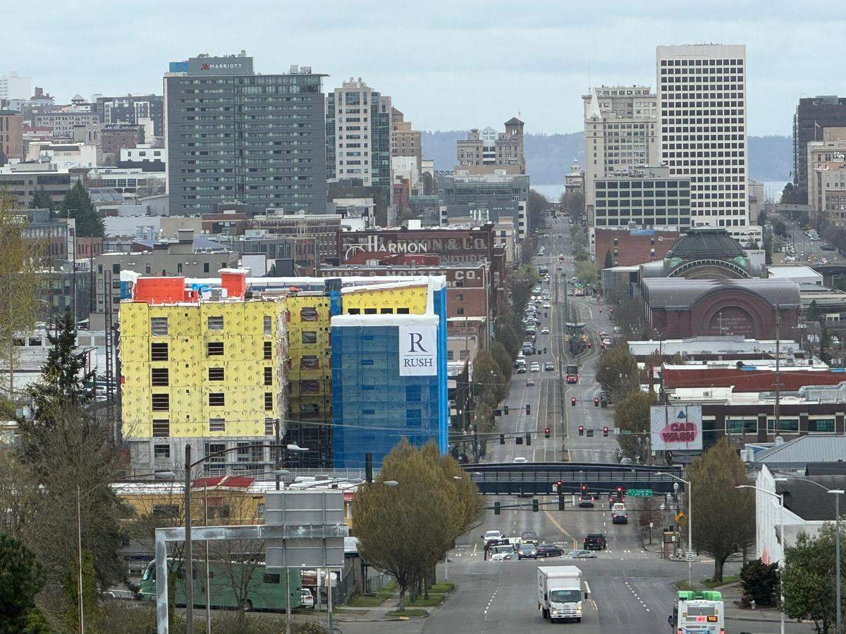 Cornus House apartment construction can be seen at left amid Tacoma’s cityscape looking down Pacific Avenue on Monday, March 25, 2024.