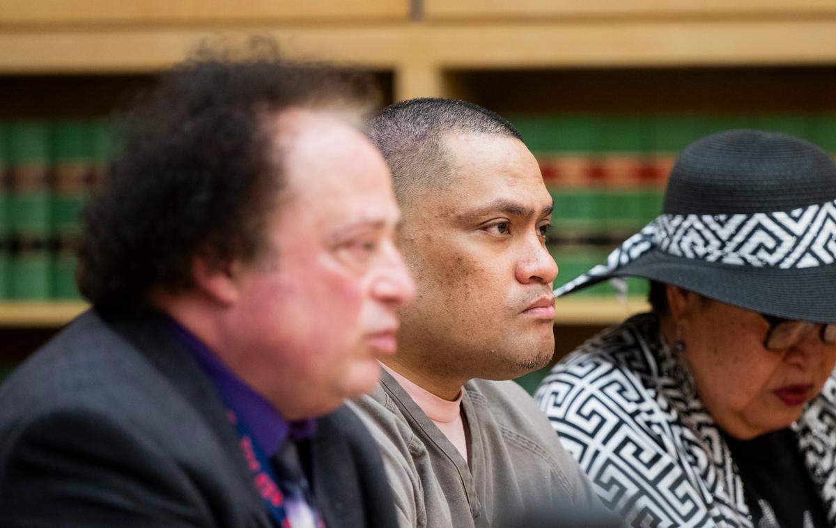 Muelu Salanoa Jr., center, is sentenced for charges related to an apartment standoff where Salanoa shot and injured Puyallup police officers, at Pierce County Superior Court, on Friday, April 11, 2025, in Tacoma, Wash.
