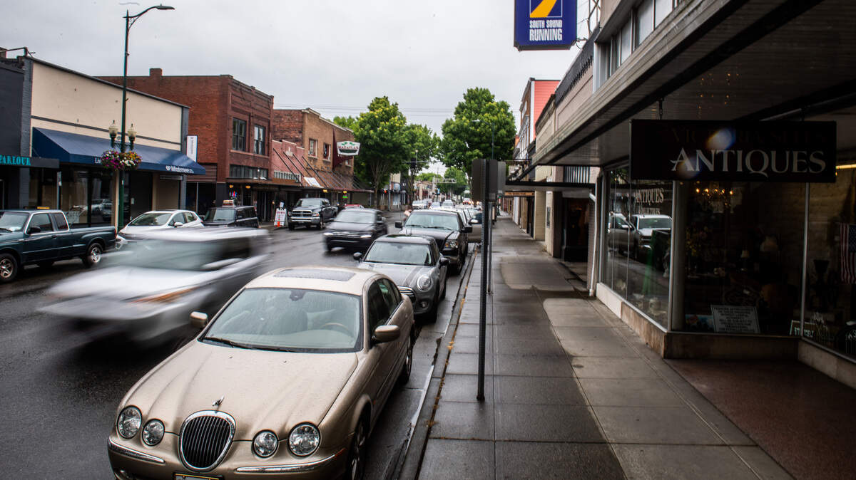 Cars drive through downtown Puyallup on May 16, 2020.