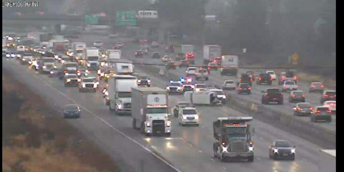 A vehicle overturned Tuesday morning on southbound Interstate 5 near Lakewood, backing up traffic for commuters in the Tacoma area.