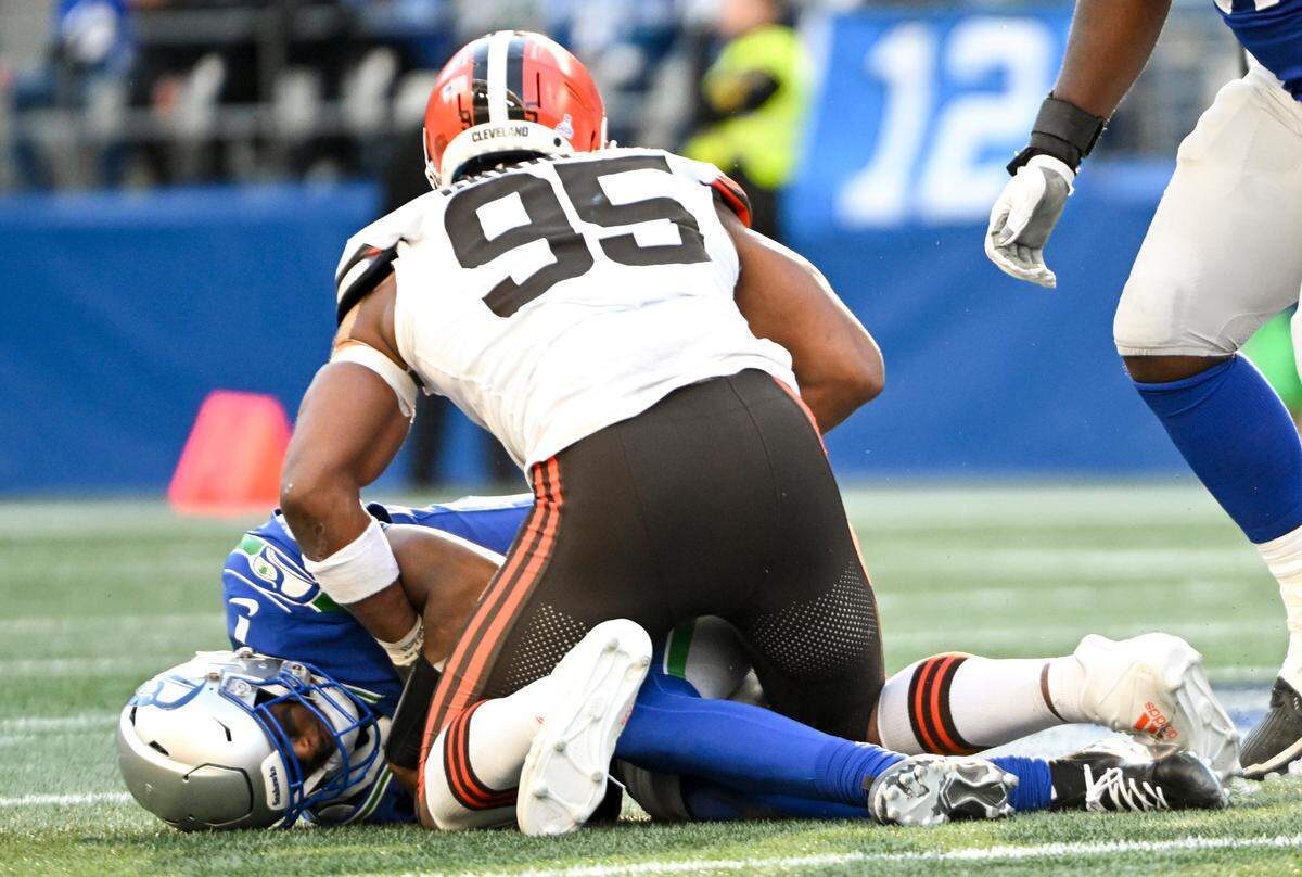 Cleveland Browns defensive end Myles Garrett (95) sacks Seattle Seahawks quarterback Geno Smith (7) during the fourth quarter of the game at Lumen Field, Sunday, Oct. 29, 2023, in Seattle, Wash.