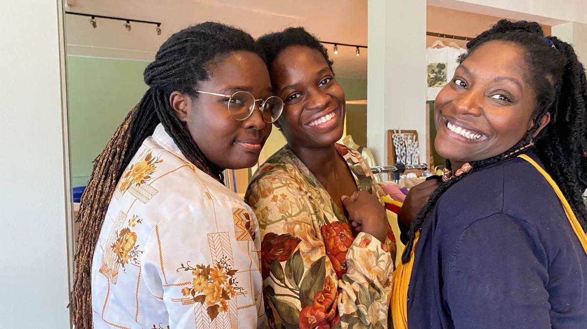 Family members and co-owners of Parable, from left, LaKecia Farmer, Le’Ecia Farmer and Deatricia Williams stand inside their store on its soft opening on Aug. 21, 2021.