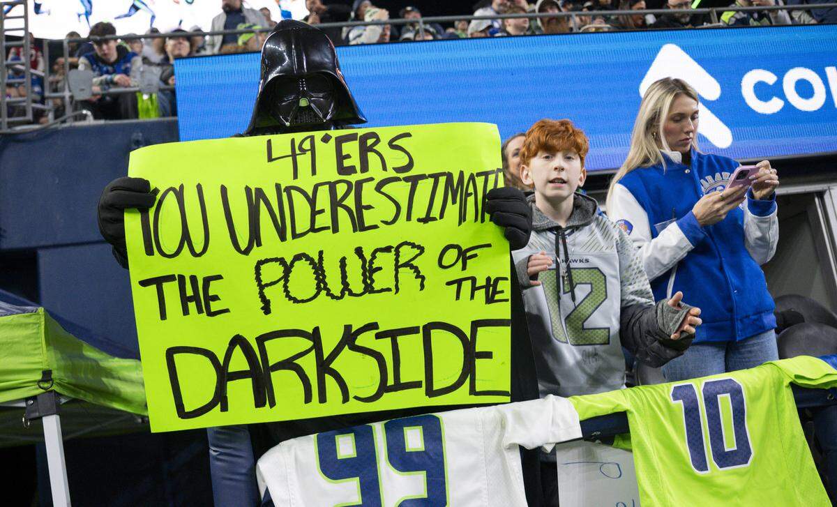 A fan dressed as Darth Vader cheers on the Seattle Seahawks defense during the second quarter of the NFC Divisional Round game between the Seattle Seahawks and the San Francisco 49ers at Lumen Field, on Saturday, Jan. 17, 2026, in Seattle.