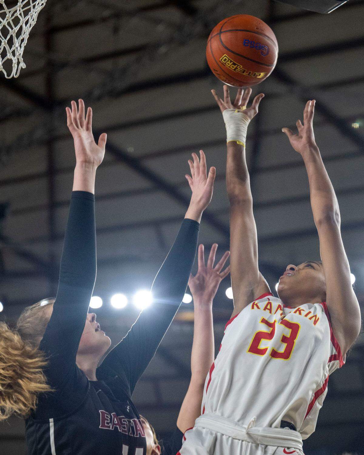 Kamiakin forward Emaunii Smith (23) attempts a shot as Eastlake forward Addison Baumgartner (15) defends during the second quarter of a Class 4A semifinal game on Friday, March 3, 2023, in Tacoma, Wash.