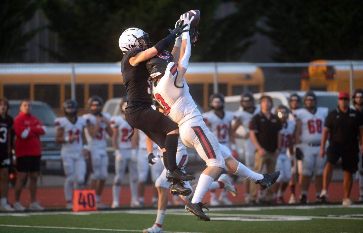 Yelm wide receiver Kyler Ronquillo (left) steals the ball away from Camas defensive back Bradley Prouse during Friday night’s season-opening football game at Yelm High School in Yelm, Washington on Friday, Sept. 2, 2022.