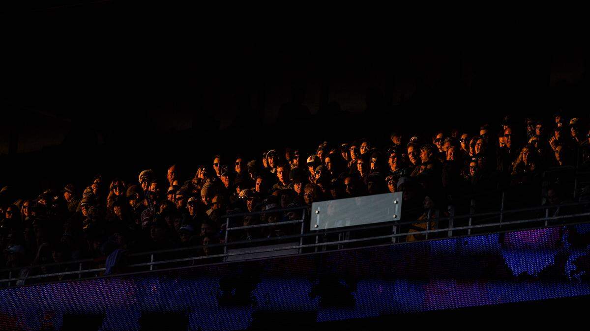 Fans watch during the fourth quarter. The Washington Huskies played the Washington State Cougars in the Apple Cup at Husky Stadium in Seattle, Wash., on Friday, Nov. 29, 2019.