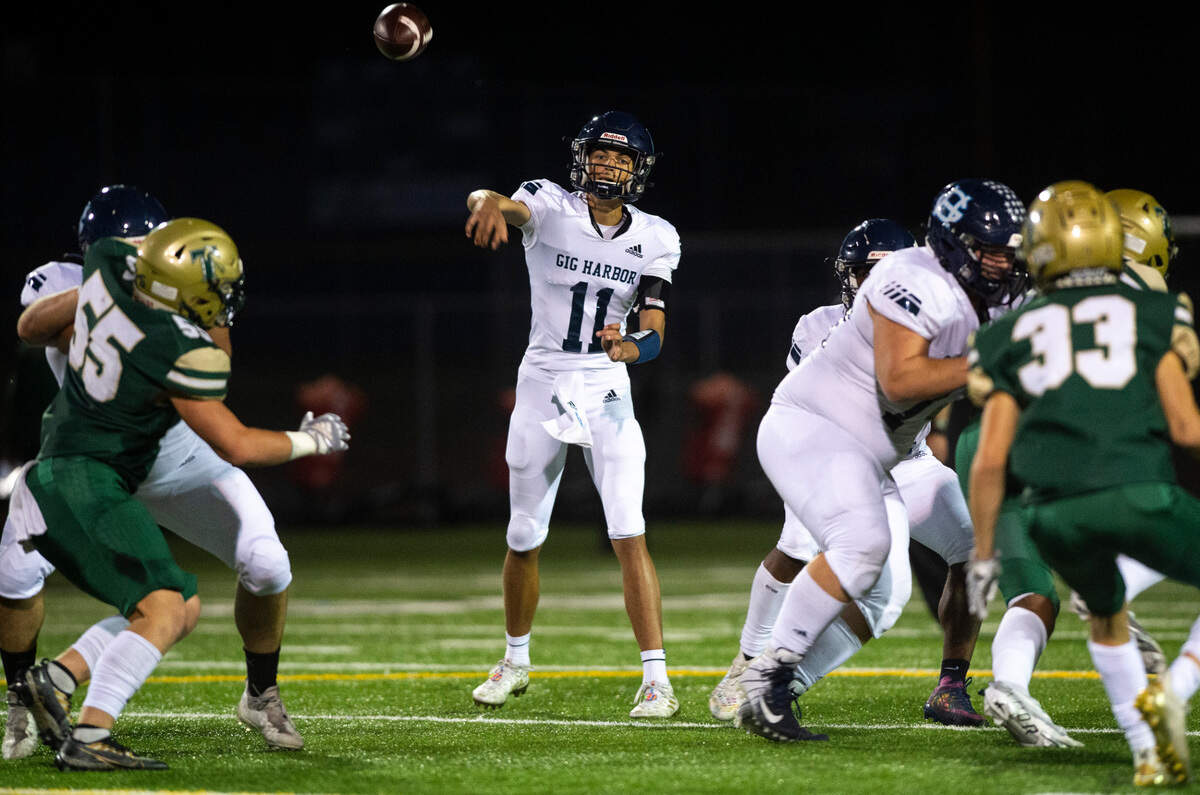 Gig Harbor quarterback Will Landram (11) passes the ball in the first quarter of a game against Timberline at the Roy Anderson Field in Purdy, Wash. on Sept. 29, 2022.