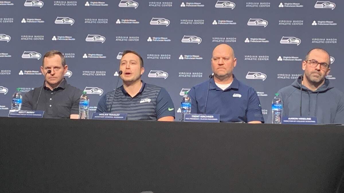 Seahawks senior director of player personnel Matt Berry, assistant general manager Nolan Teasley, vice president of player personnel Trent Kirchner and director college scouting Aaron Highline (left to right) discuss Seattle’s NFL draft board on April 18, 2024, one week before the draft begins.
