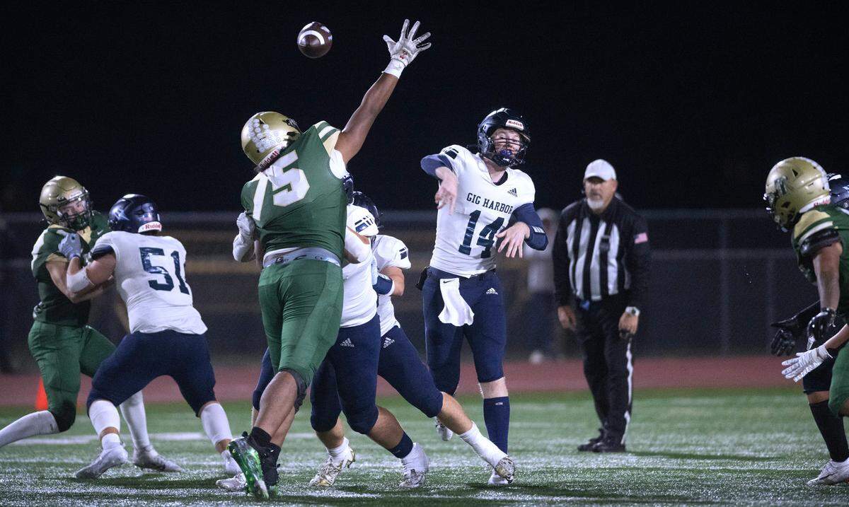 Gig Harbor quarterback Benji Park fires a pass past Timberline defensive lineman Tyrin Evans during Friday night’s football game at South Sound Stadium in Lacey, Washington, on Sept. 29, 2023. Gig Harbor won the game with a touchdown in the final minute, 17-14.