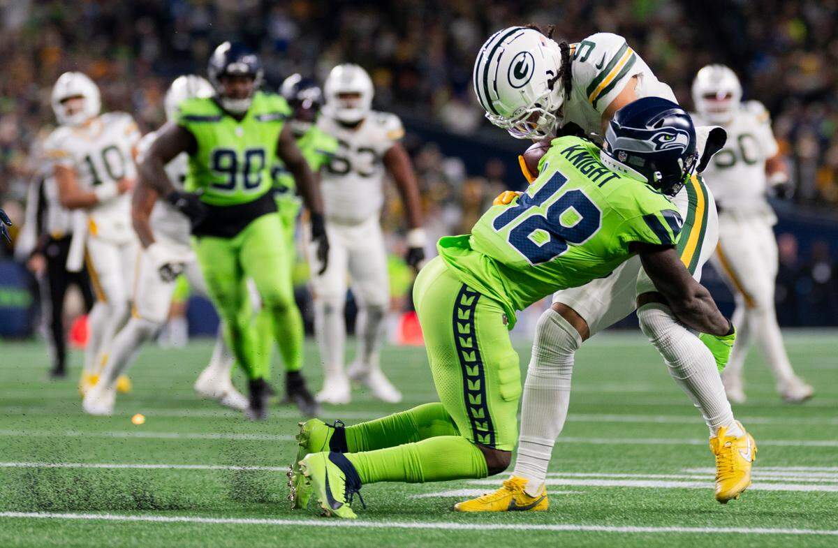 Seattle Seahawks linebacker Tyrice Knight (48) tackles Green Bay Packers wide receiver Christian Watson (9) during the third quarter of the game at Lumen Field, on Sunday, Dec. 15, 2024, in Seattle, Wash.