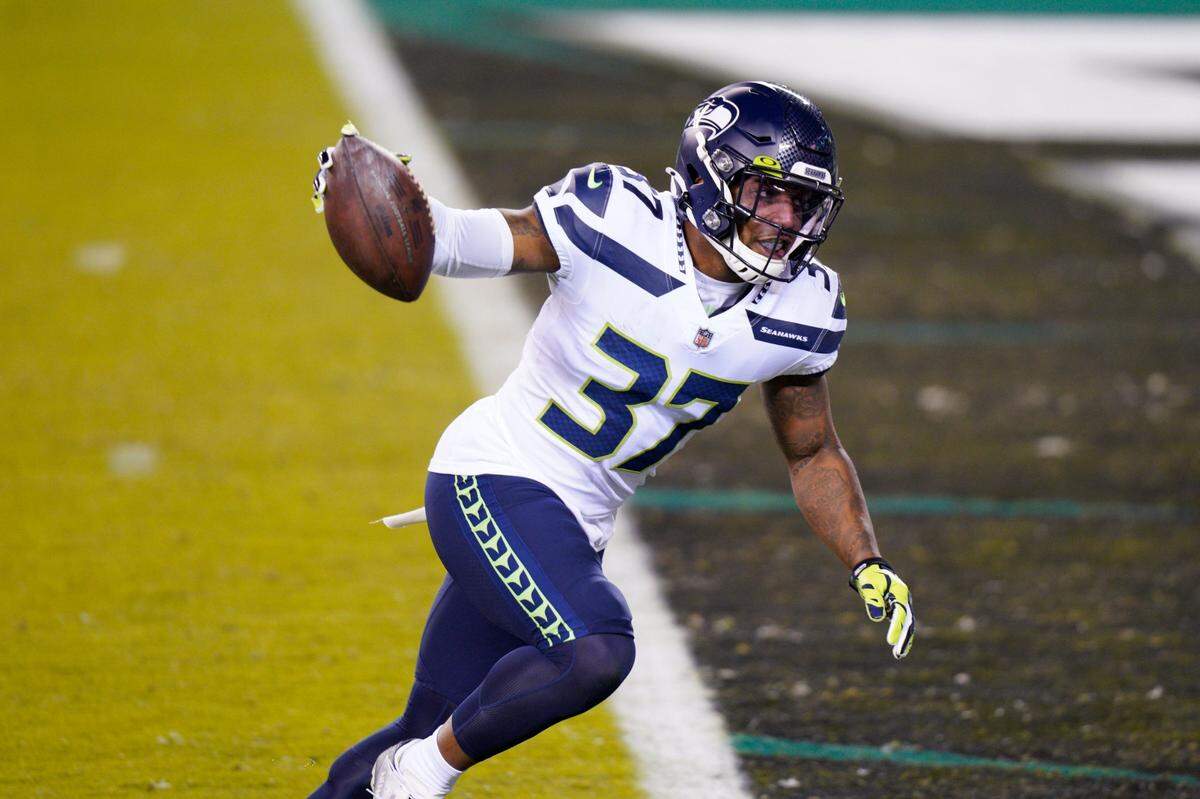 Seattle Seahawks’ Quandre Diggs reacts after intercepting a pass during the second half of an NFL football game against the Philadelphia Eagles, Monday, Nov. 30, 2020, in Philadelphia. (AP Photo/Chris Szagola)