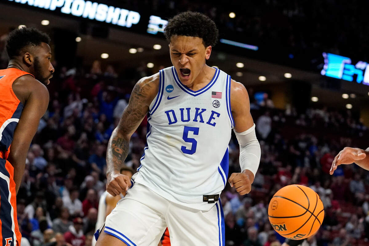 Duke’s Paolo Banchero, center, reacts after scoring during the first half of a college basketball game in the first round of the NCAA tournament against Cal State Fullerton Friday, March 18, 2022, in Greenville, S.C. (AP Photo/Brynn Anderson)