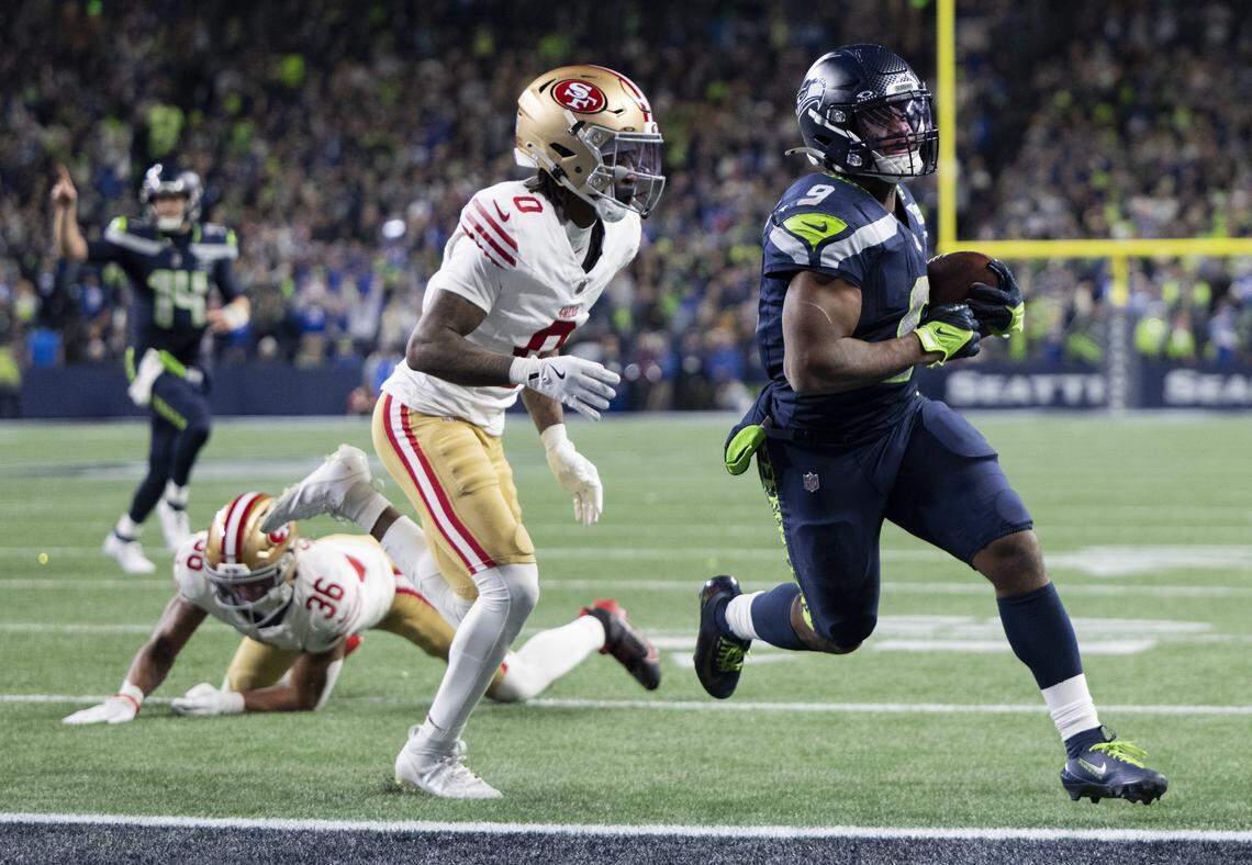 Seattle Seahawks running back Kenneth Walker III (9) runs in a touchdown during the second quarter of the NFC Divisional Round game against the San Francisco 49ers at Lumen Field, on Saturday, Jan. 17, 2026, in Seattle.