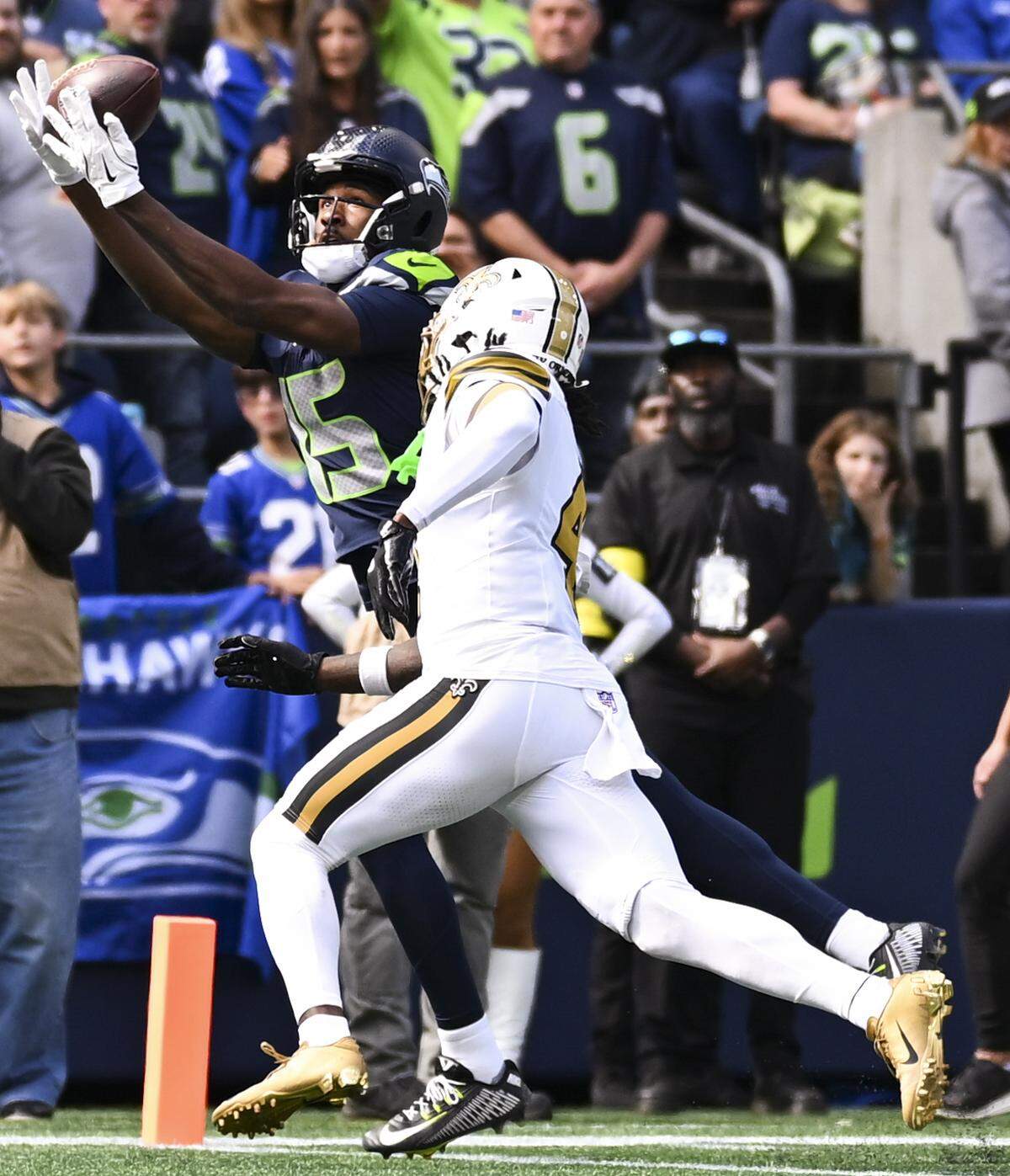 Seattle Seahawks wide receiver Tory Horton (15) catches a touchdown against New Orleans Saints cornerback Kool-Aid McKinstry (4) during the second quarter of the game at Lumen Field, on Sunday, Sept. 21, 2025 in Seattle.