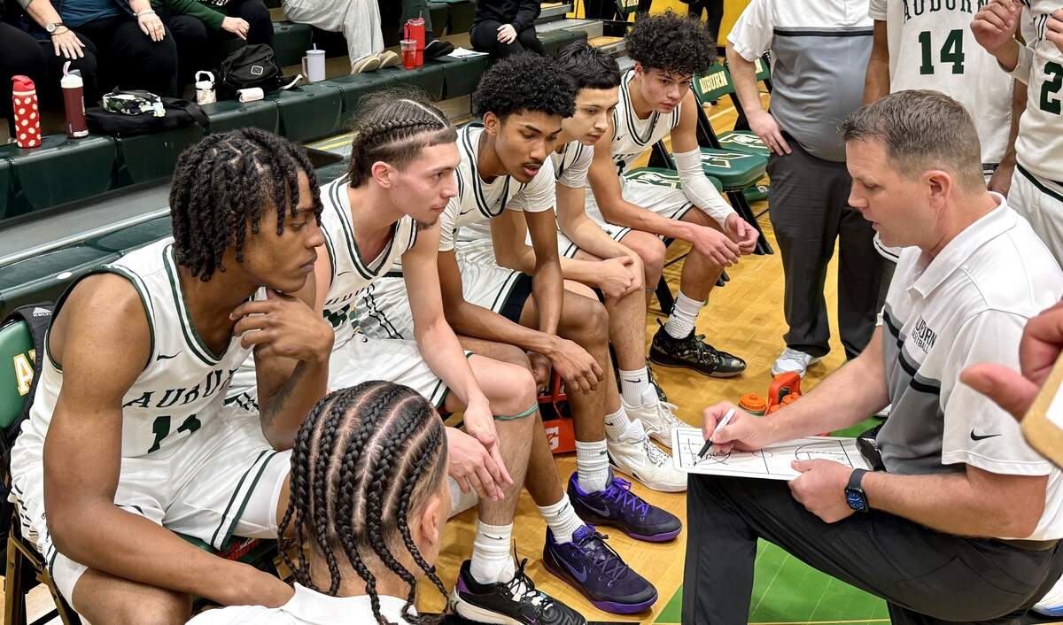 Auburn High School boys basketball coach Ryan Hansen draws up a play during a timeout in Auburn’s Class 4A District 3/4 opening round game against Spanaway Lake on Thursday, Feb. 12, 2026.