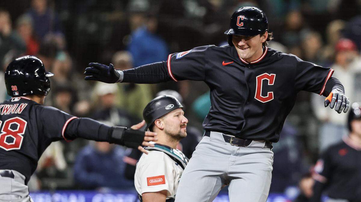 SEATTLE, WASHINGTON - MARCH 28: Chase DeLauter #24 of the Cleveland Guardians high fives Steven Kwan #38 of the Cleveland Guardians after hitting a home run during the tenth inning against the Seattle Mariners at T-Mobile Park on March 28, 2026 in Seattle, Washington. (Photo by Olivia Vanni/Getty Images)