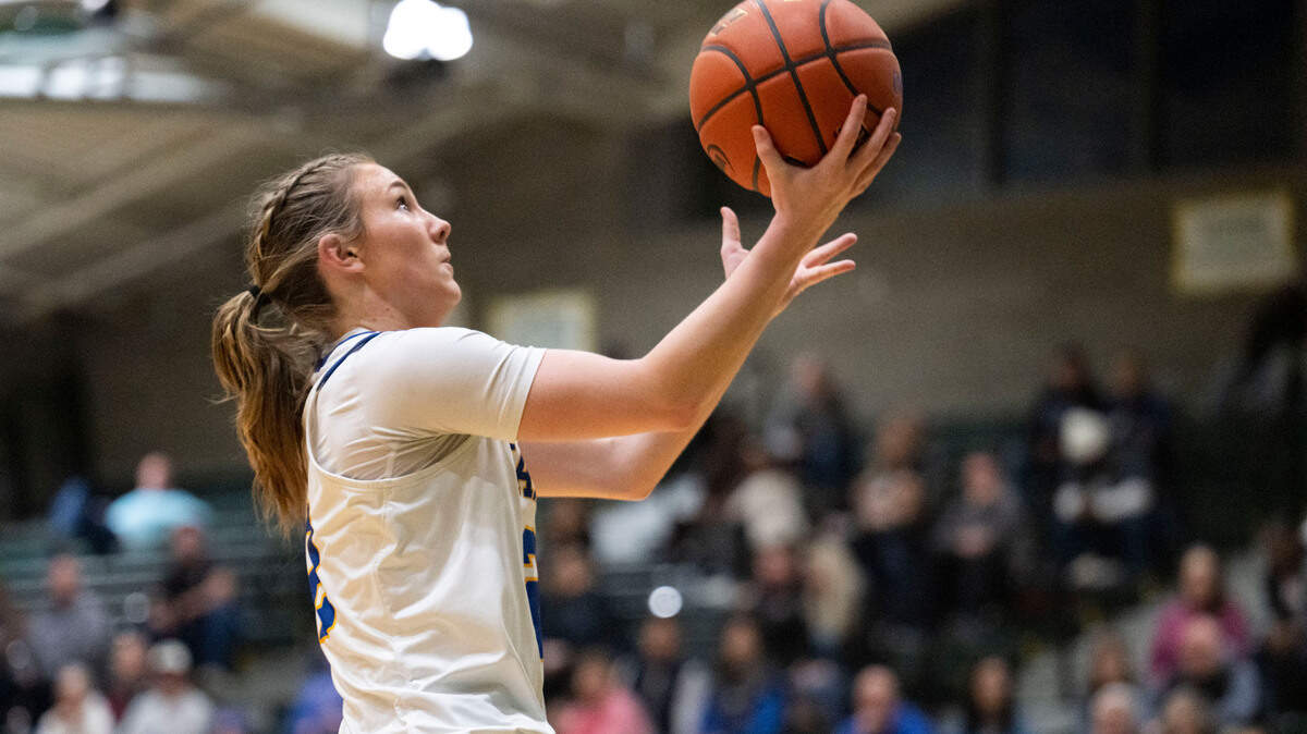Tahoma guard Hope Hassmann (2) goes in for an open layup on a fast break during the second quarter of a Class 4A state regionals game against Davis on Saturday, Feb. 25, 2023, at Auburn High School in Auburn, Wash.