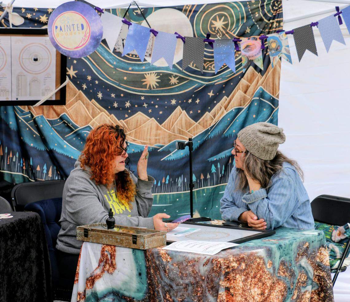 An astrology reader at Northwest Metaphysical Market in Tacoma.