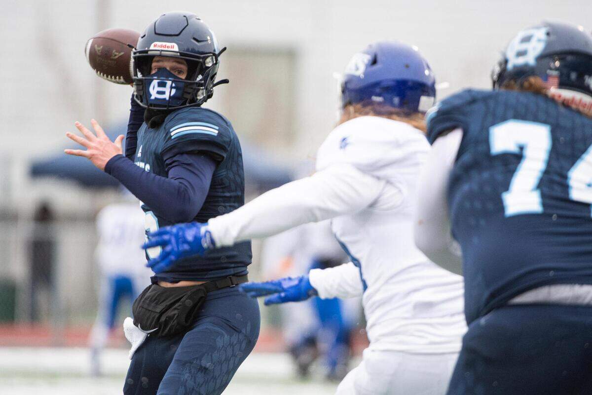 Gig Harbor’s Peyton Knowles looks to pass during the game. Gig Harbor High School played Curtis High School in a jamboree football game at Roy Anderson Field in Purdy, Wash., on Friday, Feb. 12, 2021.