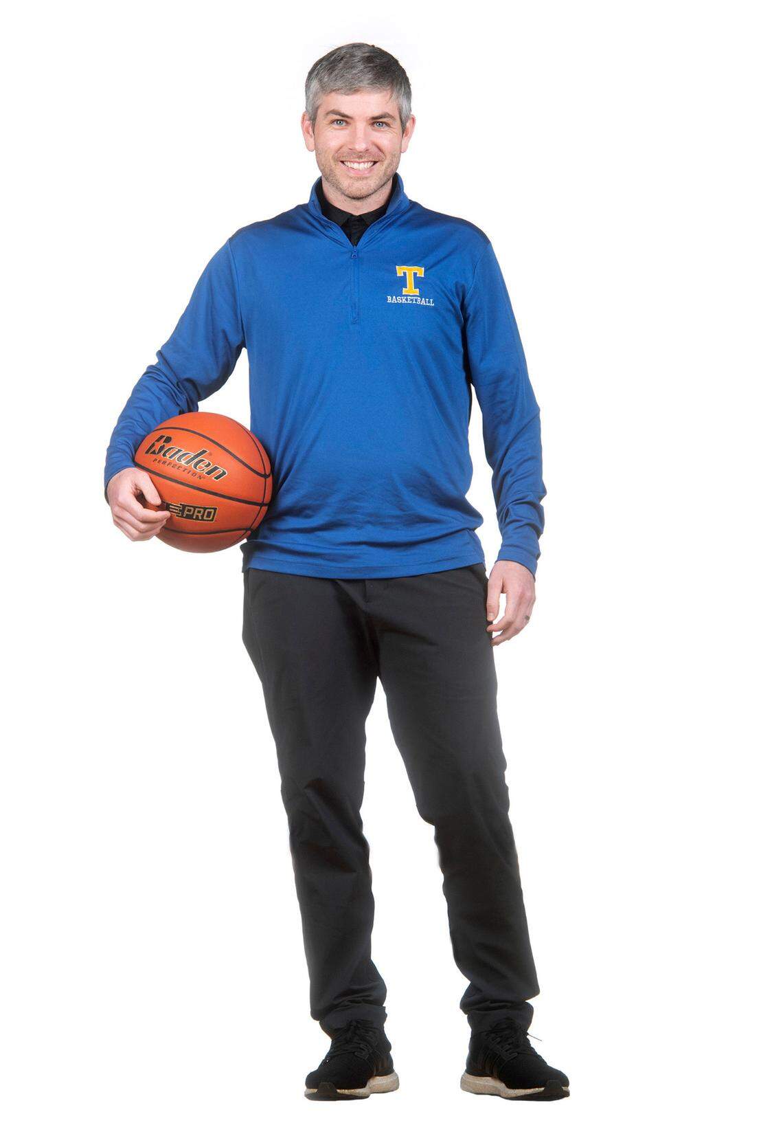 Tahoma head coach Peter Smith is The News Tribune’s All Area Girls Basketball Coach of the Year. He is photographed at Curtis High School in University Place, Washington, on Wednesday, March 15, 2023.