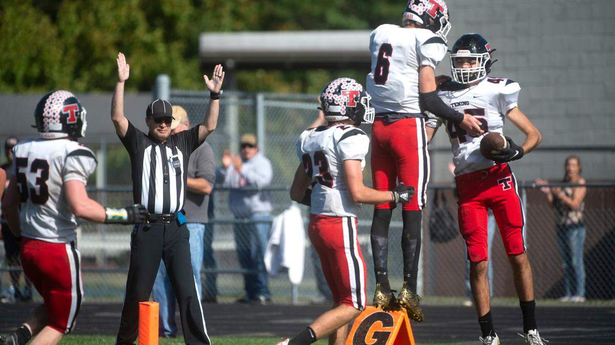 Tenino tight end Bryan Budsberg (with ball) celebrates with teammate Max Craig following his touchdown reception during Saturday’s 1A Evergreen football game at Eatonville High School on Oct. 2, 2021. Eatonville won the game, 24-22.