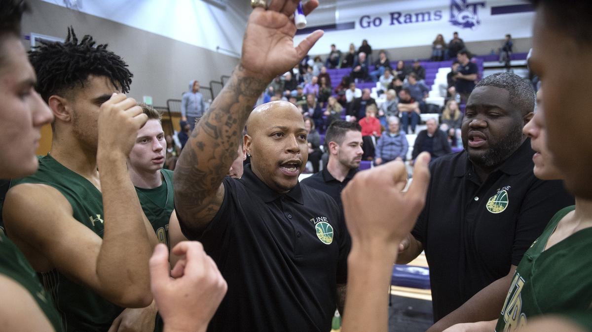 Timberline head coach Allen Thomas fires up the Blazers during Wednesday night’s boys crosstown rivalry basketball game at North Thurston High School in Lacey on Jan. 9, 2019.