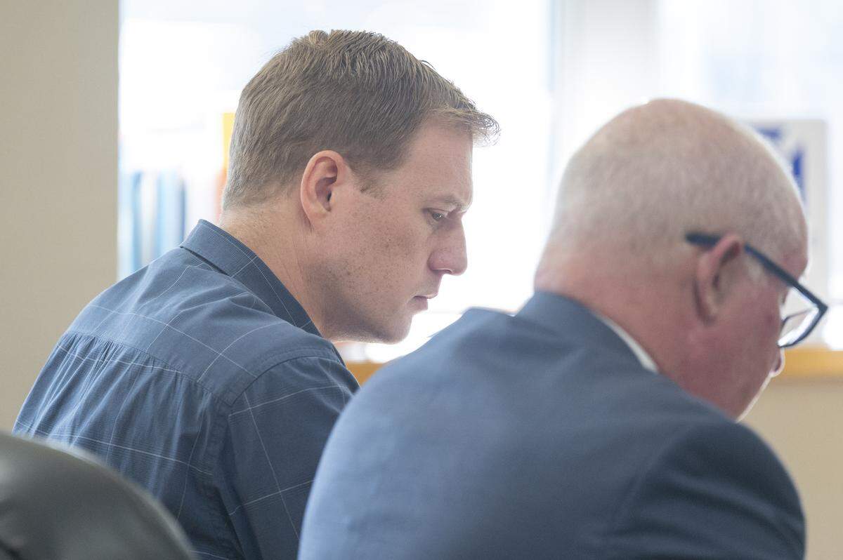 Jordan Henderson, left, hears the verdict read in his trial on Monday, Jan. 5, 2026, at Pierce County Superior Court in Tacoma. The jury found Henderson guilty on all but one of 13 counts of first-degree child molestation.