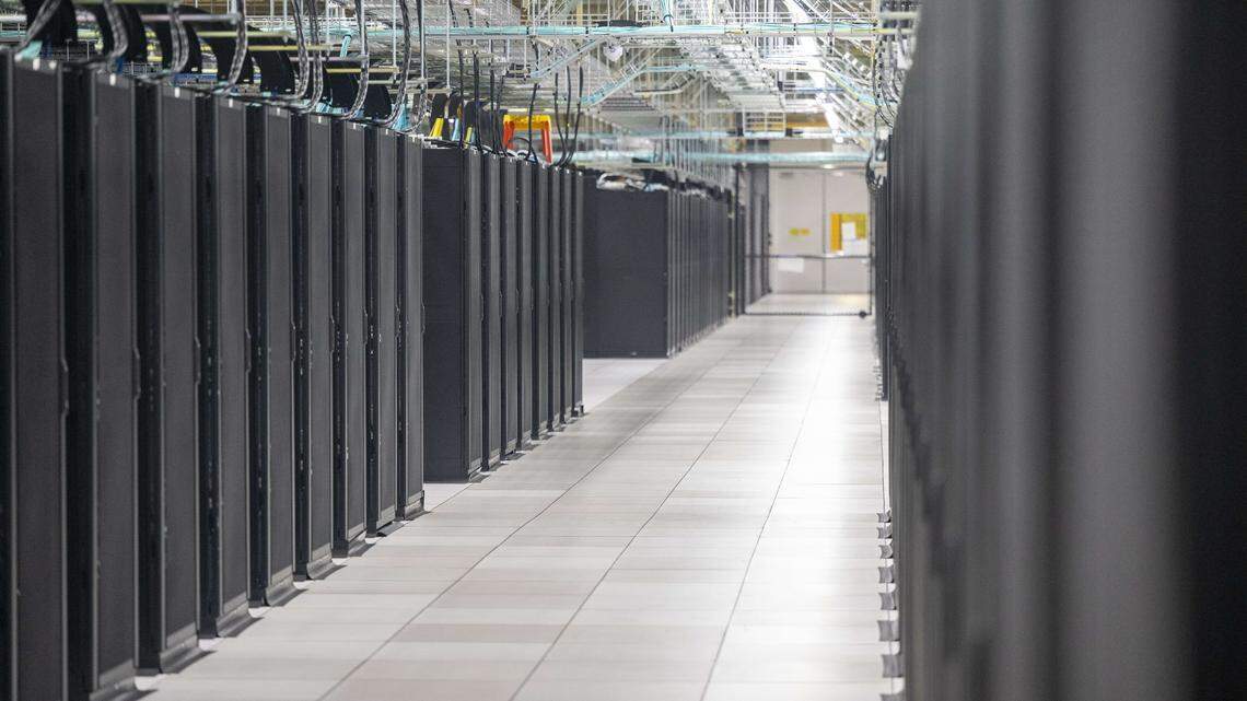 Rows of black cabinets hold servers on Friday, Feb. 13, 2026, at the Centeris SH1 Data Center in Puyallup, Wash.
