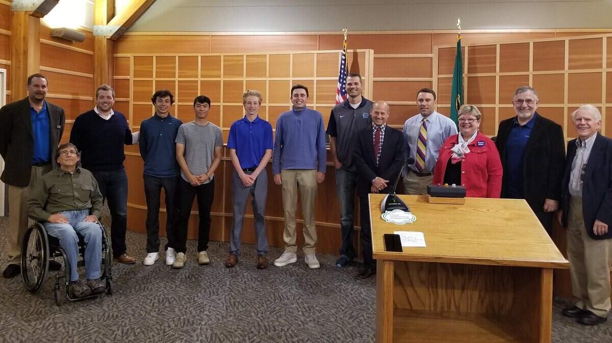Gig Harbor City Council stands with Gig Harbor High School's Golf Team, who became state champions on May 23.