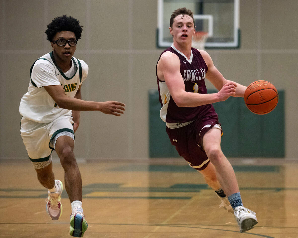 Enumclaw guard Carter DeRosier dribbles past Foss guard Aiden Finley during the third quarter of 2A SPSL game on Tuesday, Jan. 24, 2023, in Tacoma, Wash.