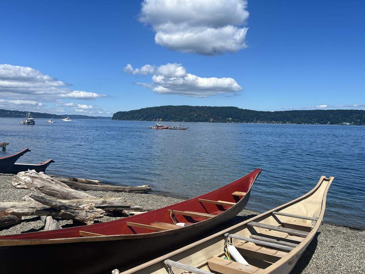 Dozens of canoes lined the shores of Owen Beach on Wednesday, July 31, 2024.
