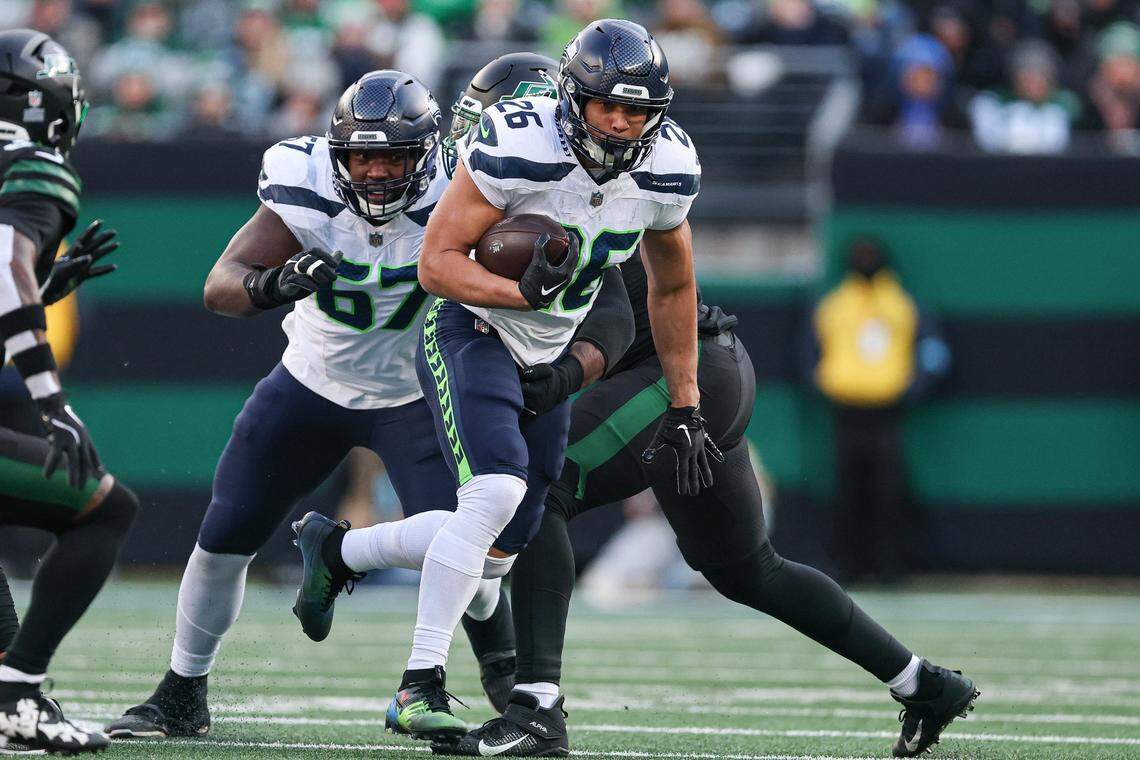 Seattle Seahawks running back Zach Charbonnet (26) carries the ball during the first half against the New York Jets at MetLife Stadium. Mandatory Credit: Vincent Carchietta-Imagn Images