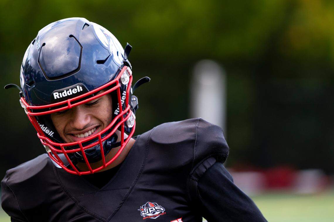 Life Christian Academy quarterback Jabez Boyd smiles during a practice at Life Christian Academy, Wednesday, Oct. 11, 2023, in Tacoma, Wash.