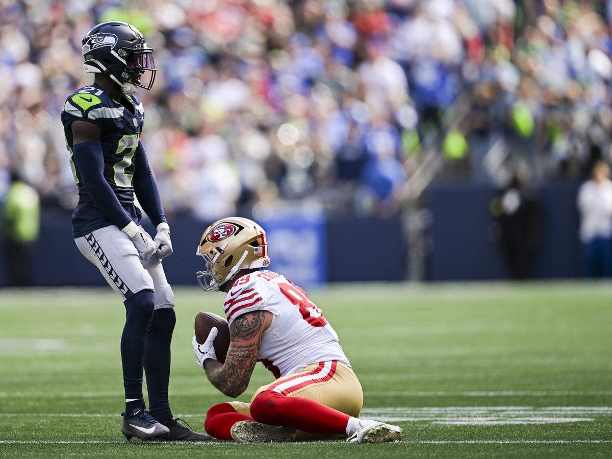 Seattle Seahawks cornerback Devon Witherspoon (21) reacts to a tackle on San Francisco 49ers tight end Luke Farrell (89) during the third quarter of the game at Lumen Field, on Sunday, Sept. 7, 2025, in Seattle.