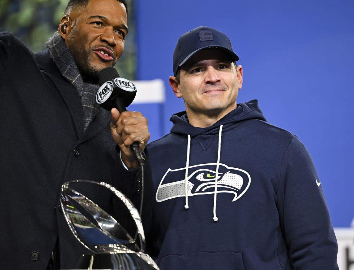 Seattle Seahawks head coach Mike MacDonald accepts the George Halas Trophy for winning the NFC Championship against the Los Angeles Rams at Lumen Field, on Sunday, Jan. 25, 2026, in Seattle.