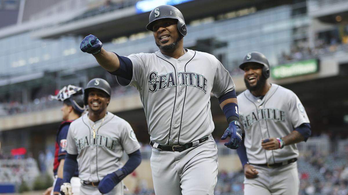 Seattle Mariners’ Edwin Encarnacion runs back to the dugout in celebration after hitting a home run against the Minnesota Twins during the second inning of a baseball game Tuesday, June 11, 2019, in Minneapolis. Minnesota won 6-5.