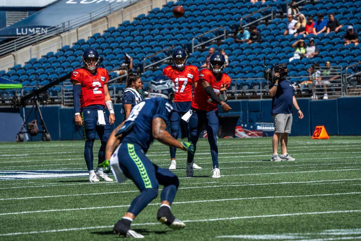 Seattle Seahawks quarterback Drew Lock throws the ball to wide receiver Freddie Swain during their warm-ups before their practice game on Saturday, Aug. 6, 2022 at Lumen Field in Seattle, Wash.