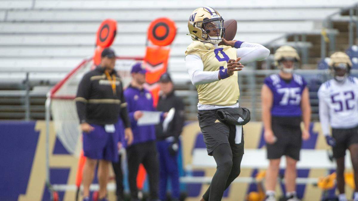 Washington quarterback Michael Penix, Jr. attempts a pass at spring practice on Wednesday, March 30, 2022, at Husky Stadium in Seattle, Wash.