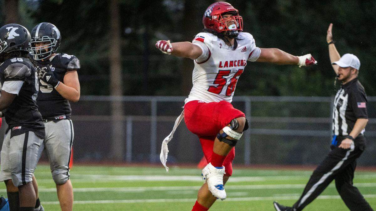 Kennedy Catholic defensive lineman Ish Taliauli celebrates after sacking Kentwood quarterback Anthony Tucker in the second quarter of a 4A NPSL game on Thursday, Sept. 15, 2022, at French Field in Kent, Wash.