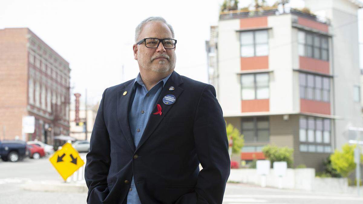 Troy Christensen of Tacoma has filed a lawsuit claiming discrimination and wrongful termination from his job as executive director of the Korean Women’s Association. Christensen alleges he was fired solely because he is gay. He is shown in downtown Tacoma on Thursday, April 25, 2019.