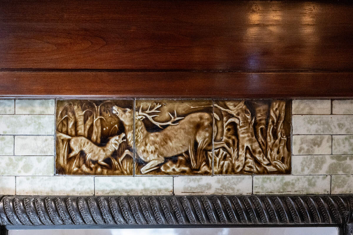 An original fireplace at the historical Hoska House includes an inlaid Czech hunting scene, pictured on Wednesday, April 30, 2025, along North D Street in Tacoma, Wash.