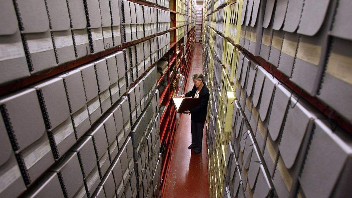 Susan Karren, regional archives director for the Seattle Branch of the National Archives and Records Administration, stands in one of the aisles of the archival stacks in this file photo from 2009.