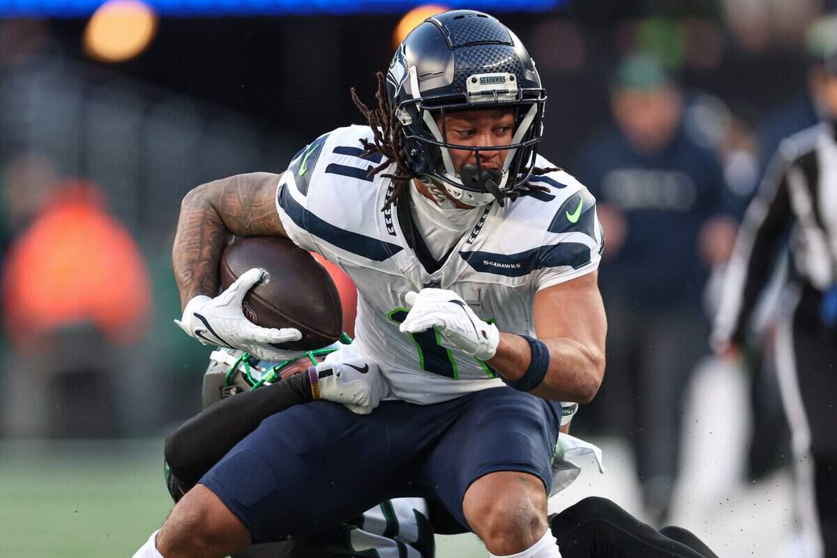 Seattle Seahawks wide receiver Jaxon Smith-Njigba (11) is tackled by New York Jets cornerback Michael Carter II (30) during the second half at MetLife Stadium. Mandatory Credit: Vincent Carchietta-Imagn Images
