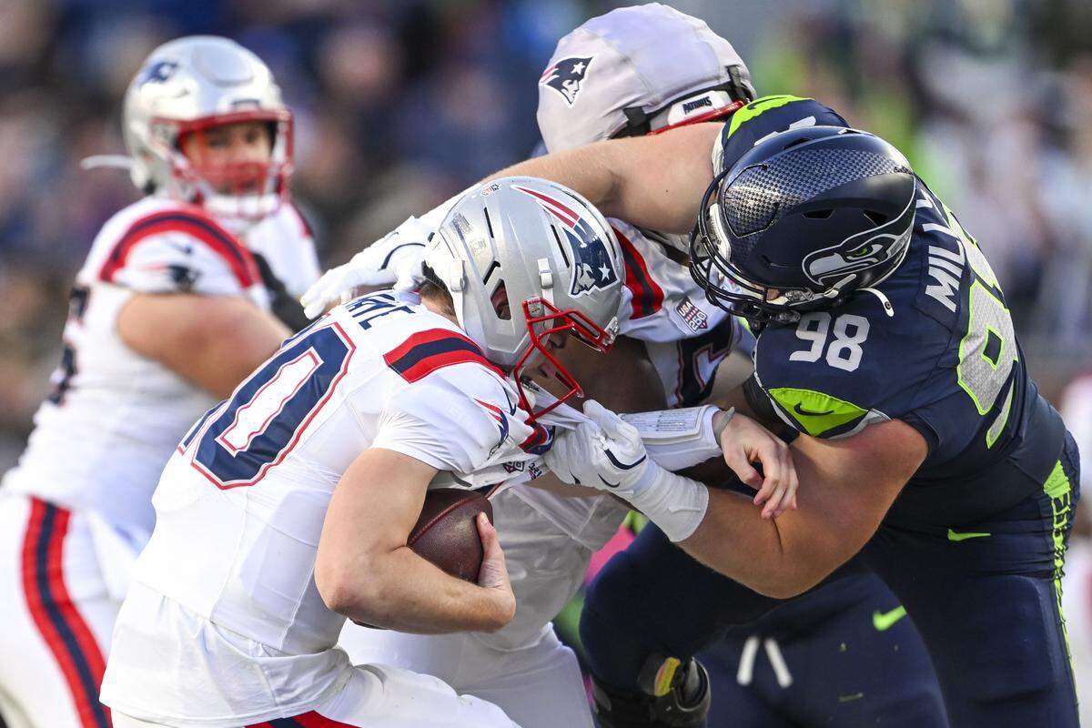 Seattle Seahawks defensive tackle Rylie Mills (98) sacks New England Patriots quarterback Drake Maye (10) during the second quarter of Super Bowl LX at Levi's Stadium on Feb. 8, 2026 in Santa Clara, Calif.